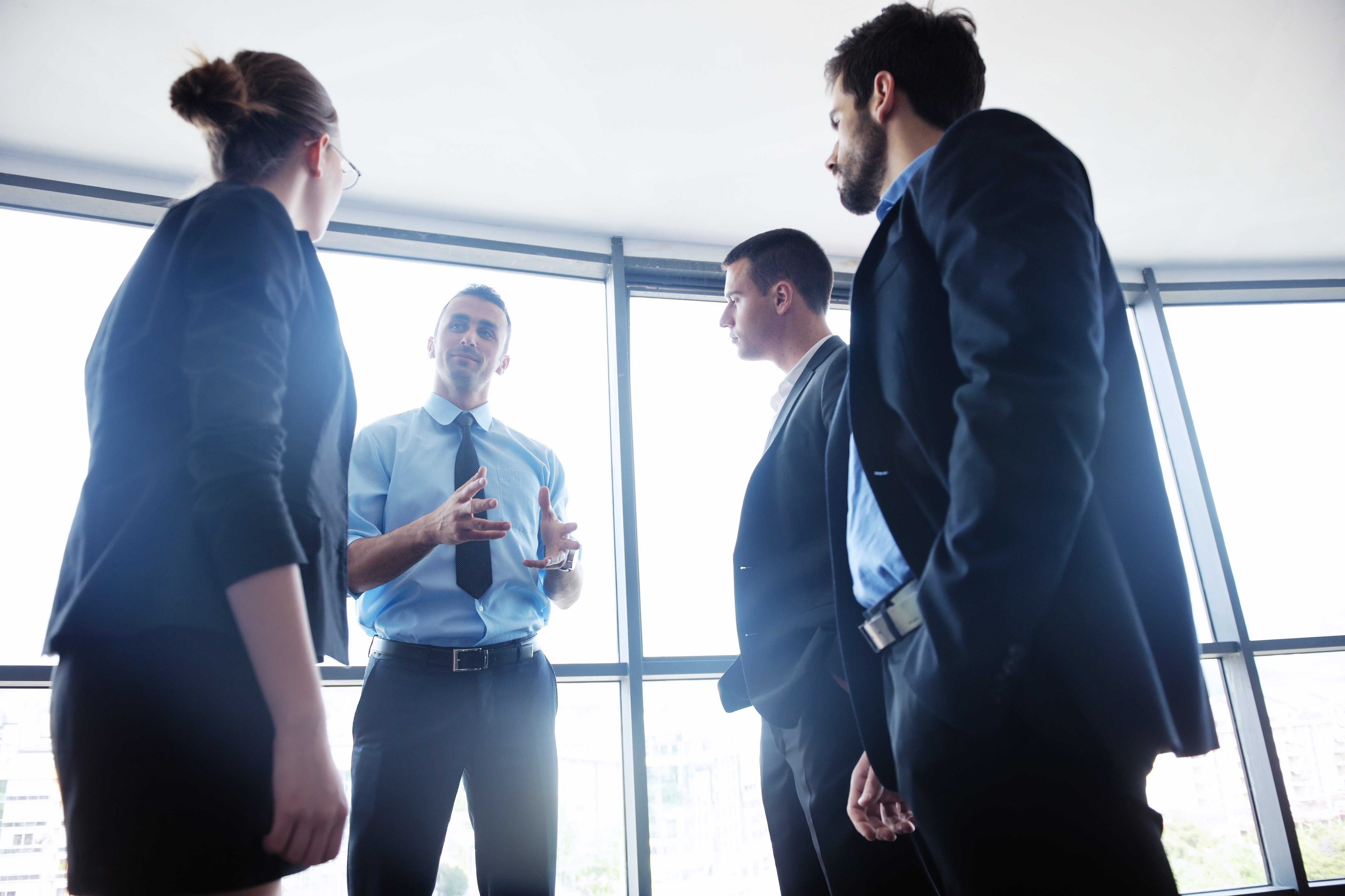 Work group standing and talking